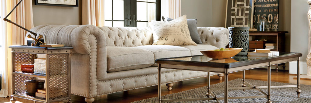 cropped-living-space-cream-couch-modern-coffee-table-side-table-overhead-lamp-black-and-white-interiors